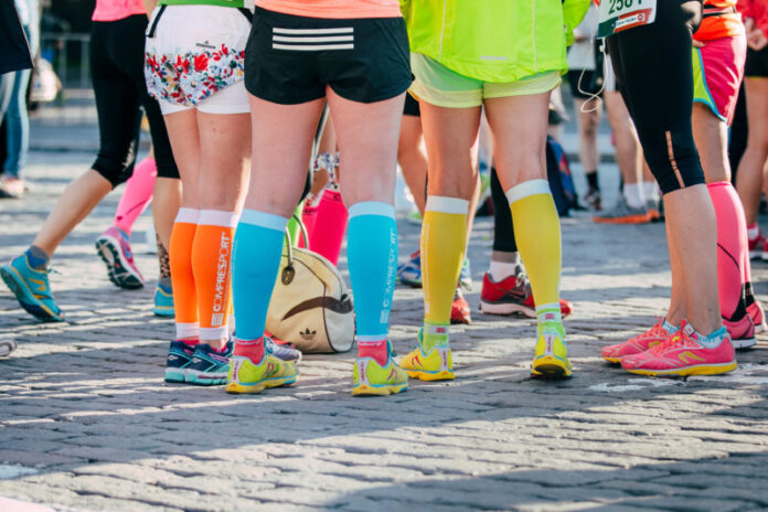 girls legs in bright sneakers