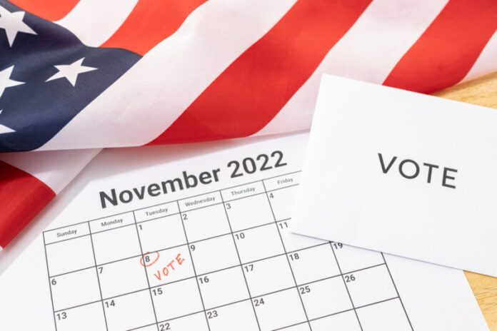 Midterm election Vote Day concept. November 8 2022 calendar marked in red and USA flag
