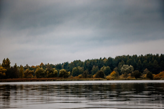 Cold autumn lake, cloudy weather