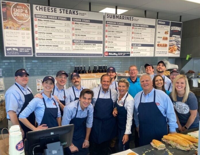 Jersey Mike’s Founder Peter Cancro (c) celebrates the 2023 Day of Giving with local charity partner, Junior Achievement of the Heartland, in Iowa.