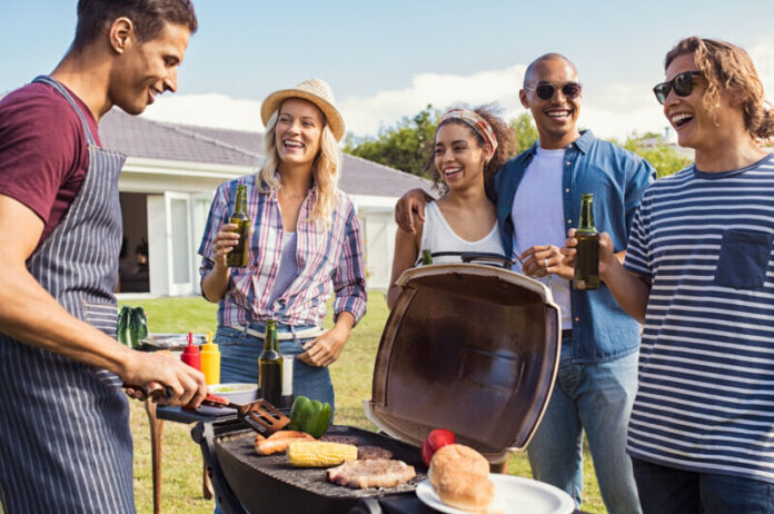 Friends enjoying party with bbq