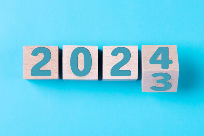 2024 Happy New Year. Wooden cube block 2024 from 2023 to 2024 on