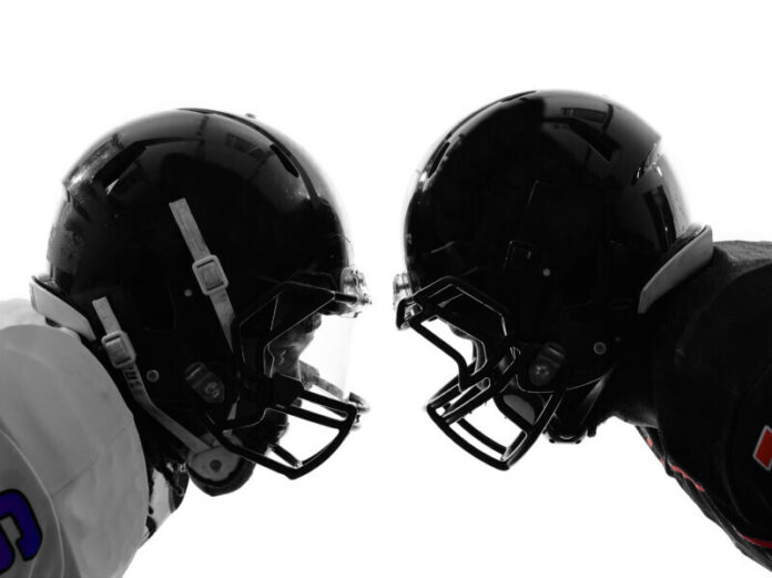 Two,American,Football,Players,Face,To,Face,In,Silhouette,Shadow