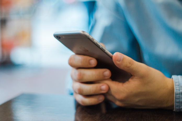 person-using-cell-phone-stock-photo