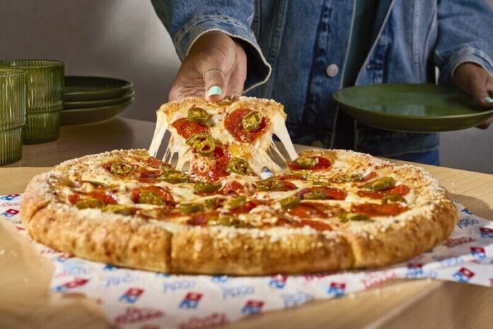 dominos-crust-stuffed Domino's is now offering Parmesan Stuffed Crust – a delicious, new crust made of premium buttery-flavored dough, stuffed with melty cheese made with 100% real mozzarella, and topped with garlic seasoning and a sprinkle of Parmesan.