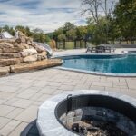 Pool Deck Perfection- Choosing Materials That Last How different pool deck materials compare