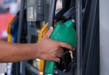 Tennessee Gas Prices Drop Three Cents, Remain Higher Than Last Year gas pump stock photo
